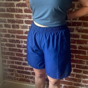 Nike Dri-Fit blue athletic shorts, with drawstring waist and pockets